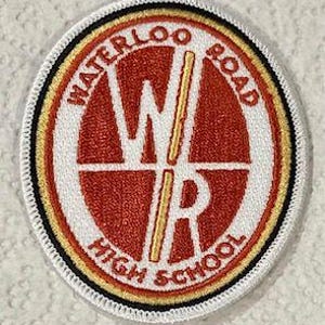 May include: A white and red embroidered patch with the words "Waterloo Road High School" and the letters "WR" in a circle.