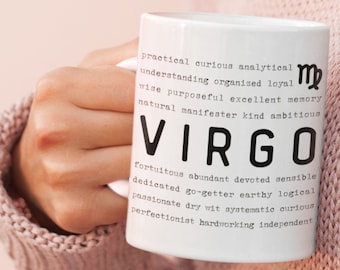 May include: White ceramic mug with black text describing the Virgo zodiac sign. The text reads: "practical curious analytical understanding organized loyal wise purposeful excellent memory natural manifester kind ambitious VIRGO fortuitous abundant devoted sensible dedicated go-getter earthy logical passionate dry wit systematic curious perfectionist hardworking independent"