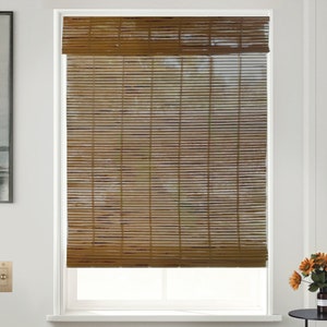 May include: Brown bamboo window blinds with a white frame. The blinds are fully extended, showing the natural texture of the bamboo.