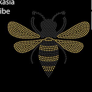 May include: A black and yellow bee design made with rhinestones. The bee is approximately 8.7 inches wide and 7 inches tall. The design is made with 10ss topaz and jet rhinestones.