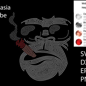 May include: A rhinestone design of a cartoon face with a cigarette in its mouth. The design is made up of clear, black, peach, and red rhinestones. The design is 9.445 inches wide and 10.429 inches tall. The design is available in SVG, DXF, EPS, and PNG formats.