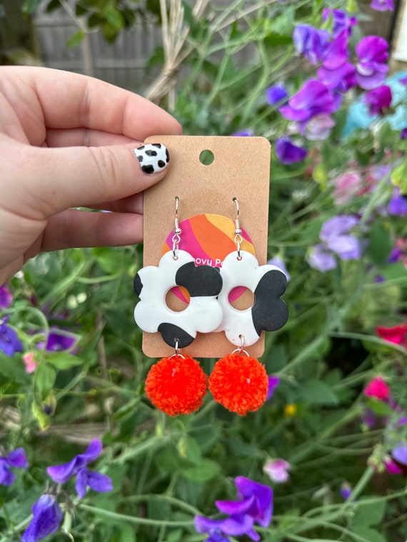 Cow print pom pom earrings online