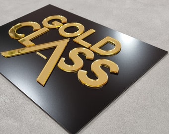 May include: Gold letters spelling "GOLD CLASS" on a black background.
