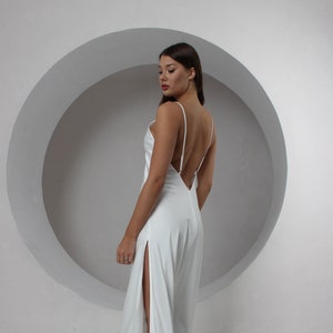 Simple wedding ivory dress with a slit Open back beach cocktail dress with V-neckline Minimalist wedding dress with a slit and straps