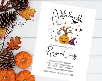 May include: A Halloween-themed baby shower invitation with a pumpkin wearing a witch's hat and surrounded by stars, bats, and ghosts. The text reads "A little boo is due" and "Reagan Cassity".