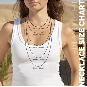 May include: A chart showing different necklace lengths in inches and centimeters. The chart shows five different lengths: 16.53 inches (42 cm), 17.71 inches (45 cm), 23.62 inches (60 cm), 27.56 inches (70 cm), and 31.5 inches (80 cm).