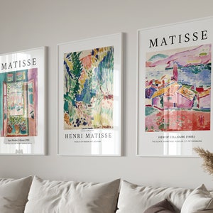 May include: Three framed art prints featuring the work of Henri Matisse. The prints are titled "Open Window, Collioure 1905", "Henri Matisse, Museum of Modern Art, New York", and "View of Collioure (1905), The State Hermitage Museum, St. Petersburg".