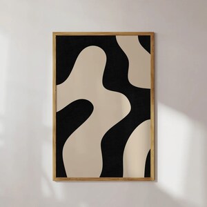 May include: Abstract art print with a black and beige color scheme. The print features organic shapes and curves.