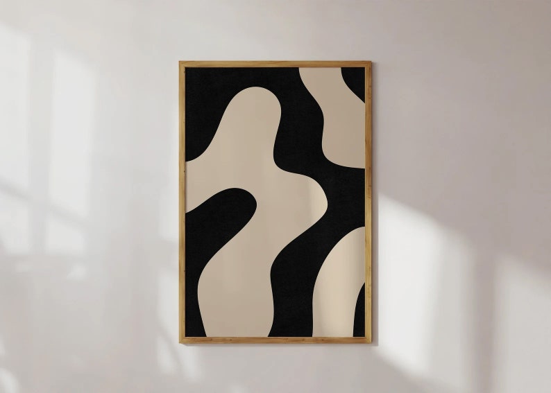 May include: Abstract art print with a black and beige color scheme. The print features organic shapes and curves.