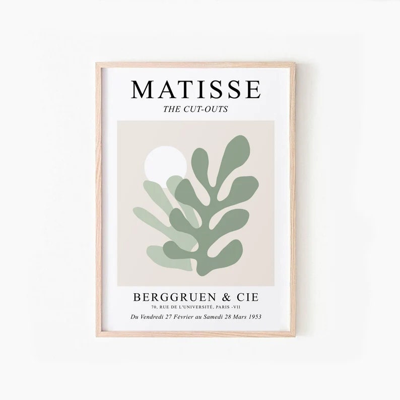 May include: A beige poster with a green abstract leaf design and a white circle. The poster has the text "MATISSE THE CUT-OUTS" at the top and "BERGGRUEN & CIE 79, RUE DE L'UNIVERSITE, PARIS -VII Du Vendredi 27 F&eacute;vrier au Samedi 28 Mars 1953" at the bottom.