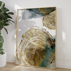 Puede incluir: Impresi&oacute;n de arte de pared abstracto con un esquema de color dorado y verde azulado. La impresi&oacute;n representa un patr&oacute;n de anillos de &aacute;rbol estilizado sobre un fondo blanco.