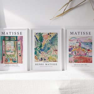 May include: Three framed art prints featuring colorful abstract paintings by Henri Matisse. The prints are titled "Open Window, Collioure 1905", "Henri Matisse" and "View of Collioure, 1905".