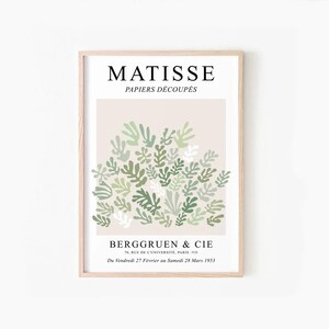 May include: A poster featuring a green and white abstract art print by Henri Matisse. The poster is titled "Matisse Papiers D&eacute;coup&eacute;s" and includes the text "Berggruen & Cie 70, Rue de l'Universit&eacute;, Paris-VII Du Vendredi 27 Fevrier au Samedi 28 Mars 1953".