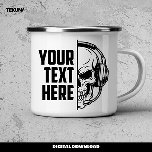 May include: White enamel mug with a black skull wearing a headset graphic. The mug has the text "YOUR TEXT HERE" in bold black letters. The words "DIGITAL DOWNLOAD" are at the bottom.