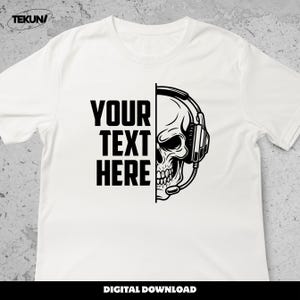 May include: White t-shirt featuring a black and white graphic of a skull wearing a headset. The left side of the shirt has the text "YOUR TEXT HERE" in bold, black letters. The words "DIGITAL DOWNLOAD" are at the bottom.