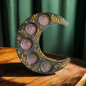 Black and gold crescent moon candle holder