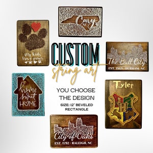 May include: Custom string art designs on wooden plaques. Designs include a paw print, a house, a state outline, a city skyline, and a Hogwarts crest. The plaques are 12 inches and beveled.