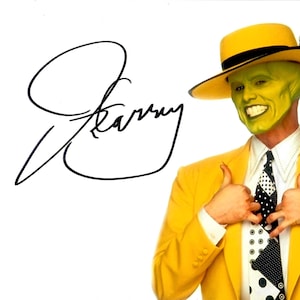 May include: Image of The Mask character from the movie, wearing a yellow suit, hat, and tie with a black and white polka dot pattern. The character has green skin and is giving a thumbs up. The signature "Jim Carrey" is on the left.