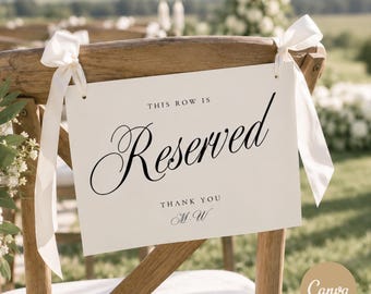 May include: A rectangular white sign attached to a wooden chair with cream-colored ribbons. The sign features black text that reads THIS ROW IS Reserved, followed by THANK YOU and the initials M.W in a decorative script font style.