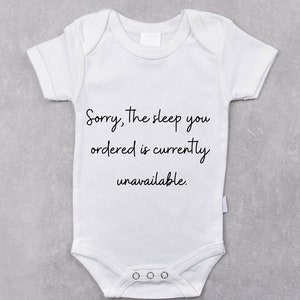 May include: White baby onesie with the text "Sorry, the sleep you ordered is currently unavailable."
