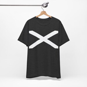 May include: Dark gray t-shirt with a large white X design across the chest. The short-sleeved shirt is hanging on a wooden hanger against a white background. The X design is centered and takes up a significant portion of the shirt's front.