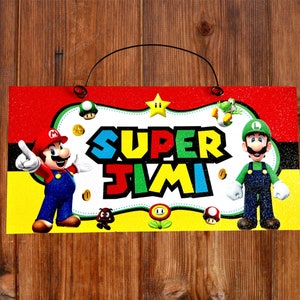 May include: A red, yellow, and green sign with the words "SUPER JIMI" in a colorful, cartoon font. The sign features a cartoon image of Mario and Luigi from the Super Mario Bros. video game.