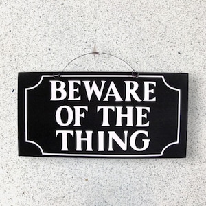 Beware of the Thing Addams Family sign. Wood or metal options.