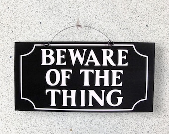 Beware of the Thing Addams Family sign. Wood or metal options.