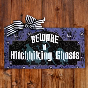 Beware of Hitchhiking Ghosts sign.