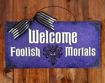 Welcome Foolish Mortals Haunted Mansion sign.