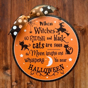 Tis near Halloween round wood sign.