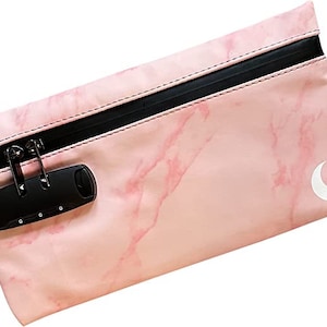 May include: Pink zippered pouch with a marble pattern and a white crescent moon design. The pouch has a black combination lock.