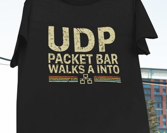 May include: Black t-shirt with a vintage-style graphic that reads "UDP Packet Bar Walks A Into" with a pixelated design.