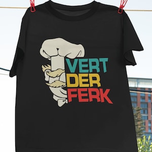 May include: Black t-shirt with a retro-style graphic of a chef holding a rolling pin and the text "VERT DER FERK".