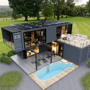 May include: A contemporary two-storey house built from repurposed shipping containers. The grey structure has large glass windows, a rooftop deck with seating, and a swimming pool. Solar panels are installed on the roof, and the house is set in a green lawn.
