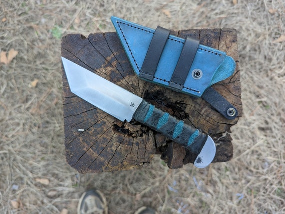 Hand forged 5160 spring steel Tonto with leather wrapped handle. Choice in handle colors.