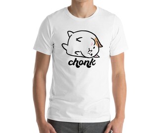 以下が含まれることがあります： 白いTシャツに、茶色とオレンジの模様の白い猫の漫画のイラストが描かれています。猫は横向きに寝ていて、目は閉じ、頬にはピンクの赤みが差しています。猫の下には「chonk」という文字が印刷されています。