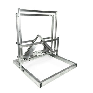 May include: A silver metal frame with a hinged, adjustable top. The frame is designed to hold a piece of artwork or a photograph.