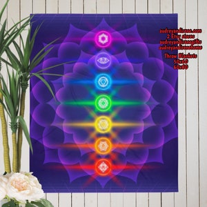 May include: A purple throw blanket with a mandala design featuring seven chakras in a vertical line. The chakras are represented by colorful circles with symbols inside. The blanket is available in two sizes: 50x60 and 60x80 inches.