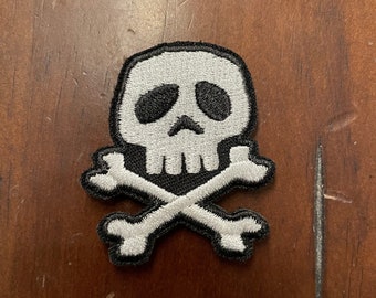 Embroidered Skull and Crossbones patch with hook type backing