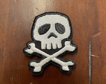 Embroidered Skull and Crossbones patch with hook type backing