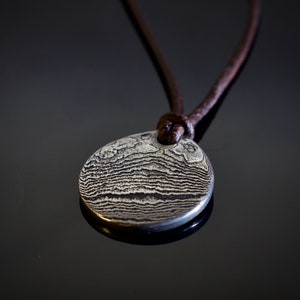 Damascus PENDANT. Forged in Montana. Unique. Layered Steel. Rugged. Leather cord. Necklace. Gifts. For him. For her. Jewelry. Best seller