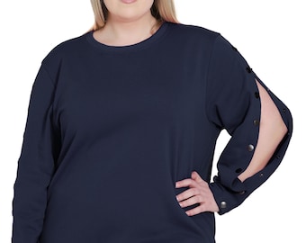 May include: A navy blue long-sleeved sweatshirt with snap buttons on the sleeves. The sweatshirt has a relaxed fit and a round neckline.