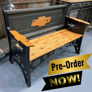 May include: A black metal bench with a wooden seat and back. The back is made from a repurposed truck tailgate with a Chevrolet logo. The bench has a pre-order now sign.