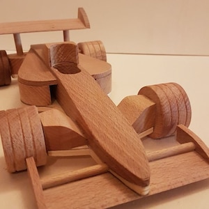 handmade Formula 1 car racing car made of wood as a children&#39;s toy for the little ones or for fans of the sport as decoration or collector&#39;s item