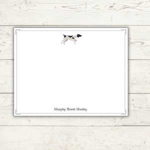 May include: A white card with a black and white illustration of a dog running. The text "Murphy Brent Mosley" is printed at the bottom of the card.
