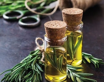 May include: Two clear glass bottles with cork stoppers filled with golden yellow rosemary essential oil. The bottles are surrounded by sprigs of fresh rosemary.