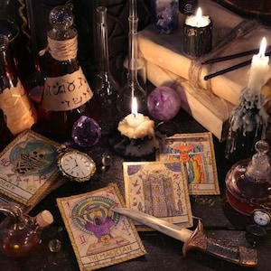 May include: A dark wooden table with a variety of tarot cards, candles, and glass bottles. The cards are spread out on the table, and the candles are lit. The bottles are filled with various liquids, and some have labels with text. There is a pocket watch and a dagger on the table.