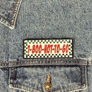 May include: A denim jacket with a black and green checkered patch that says "1-800-HOT-TO-GO" in red letters.