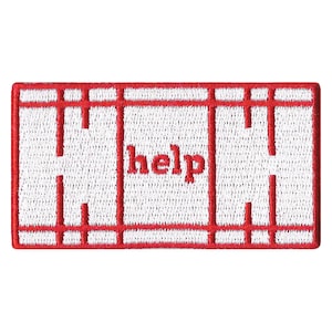 May include: Embroidered patch with a white background and a red border. The patch features a red grid design and the word "help" in red letters.